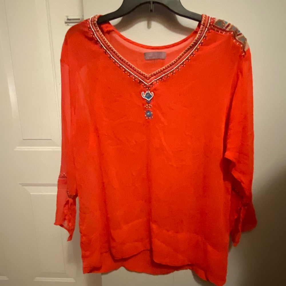Red, beaded blouse by Harper